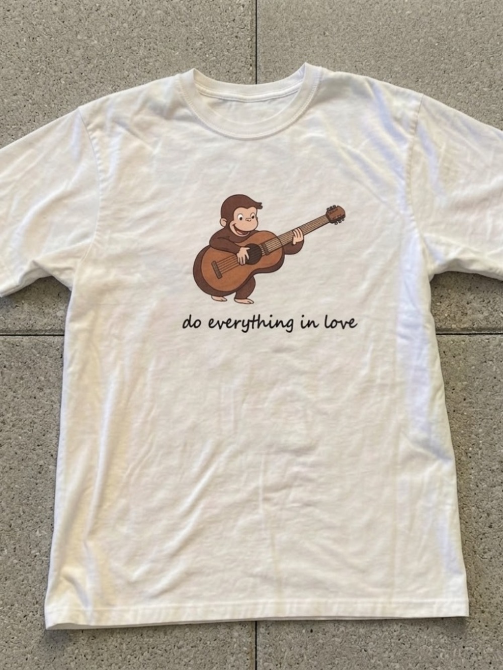 White Graphic T-Shirt with Monkey Playing Guitar - "do everything in love"